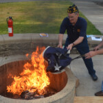 Post 594 Flag Day 2017 - A very large flag is prepared for burning. Post 594 Flag Day 2017